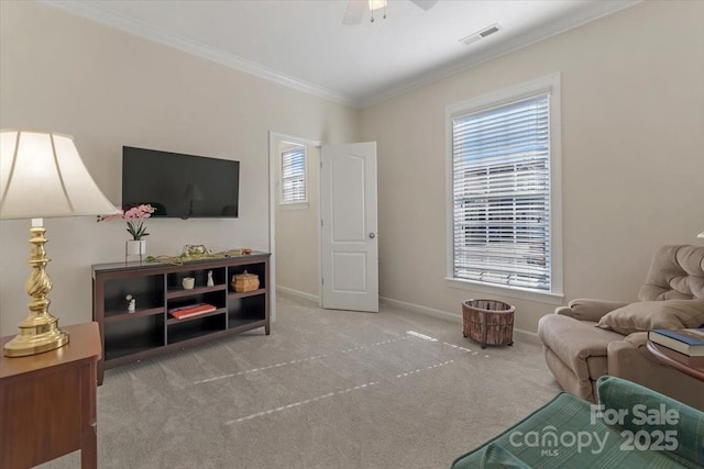 13311 Union Square Dr, Huntersville, NC 28078 - living area featuring visible vents, baseboards, ornamental molding, ceiling fan, and carpet flooring