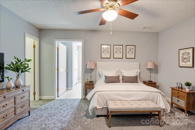 bedroom featuring baseboards, ceiling fan, carpet, and visible vents
