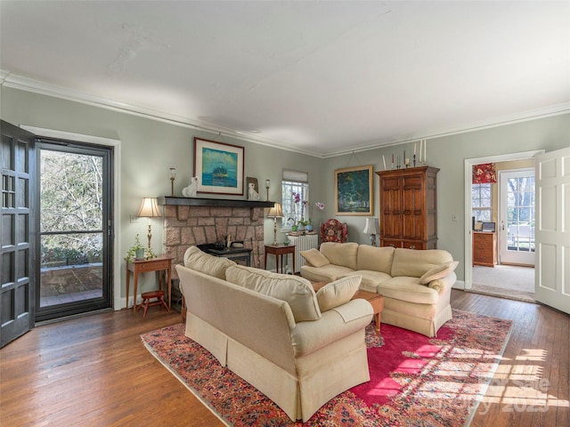 250 Kimberly Ave, Asheville, NC 28804 - living room featuring a stone fireplace, baseboards, crown molding, and hardwood / wood-style flooring