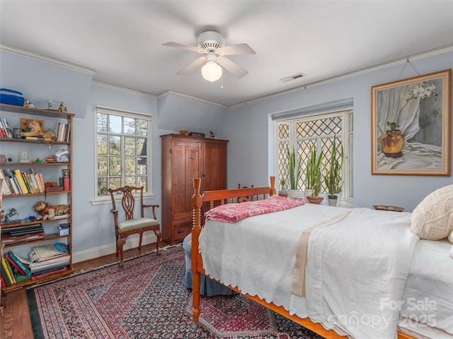 250 Kimberly Ave, Asheville, NC 28804 - bedroom featuring a ceiling fan, wood finished floors, baseboards, visible vents, and ornamental molding