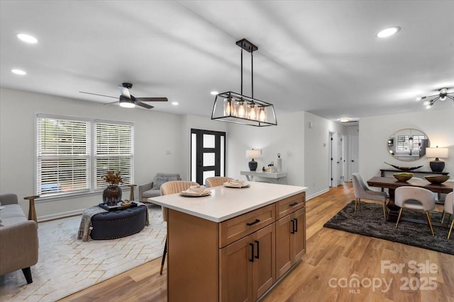 4932 Delivau Dr, Charlotte, NC 28215 - kitchen with open floor plan, light wood-type flooring, light countertops, and recessed lighting