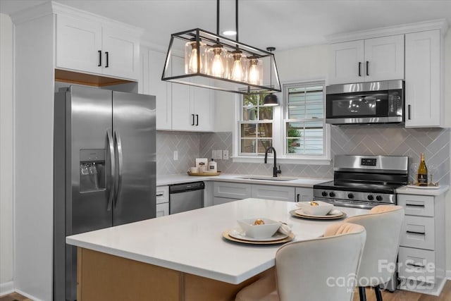 4932 Delivau Dr, Charlotte, NC 28215 - kitchen featuring appliances with stainless steel finishes and light countertops