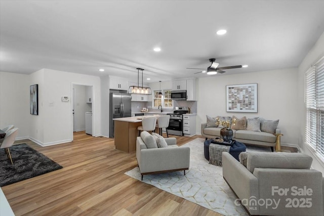 4932 Delivau Dr, Charlotte, NC 28215 - living area with recessed lighting, light wood finished floors, and a ceiling fan