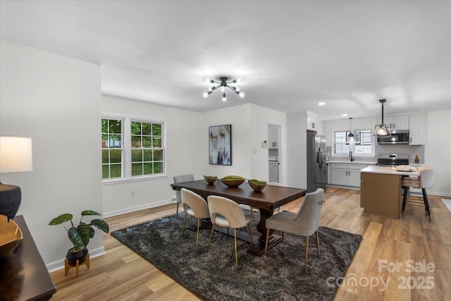 4932 Delivau Dr, Charlotte, NC 28215 - dining area with light wood-type flooring and recessed lighting