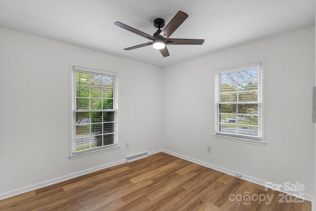4932 Delivau Dr, Charlotte, NC 28215 - spare room with plenty of natural light, wood finished floors, and ceiling fan
