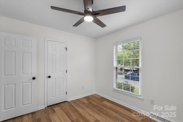 4932 Delivau Dr, Charlotte, NC 28215 - unfurnished bedroom featuring wood finished floors and ceiling fan