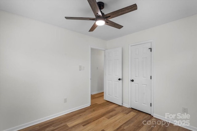 4932 Delivau Dr, Charlotte, NC 28215 - unfurnished bedroom with wood finished floors and a ceiling fan