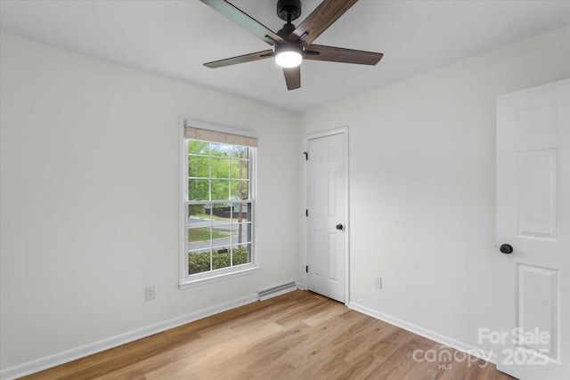 4932 Delivau Dr, Charlotte, NC 28215 - empty room featuring ceiling fan, light wood-type flooring, and a baseboard radiator