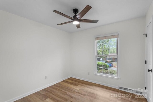 4932 Delivau Dr, Charlotte, NC 28215 - unfurnished room featuring a ceiling fan and light wood-type flooring