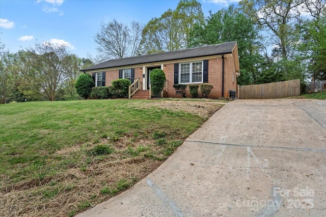 4932 Delivau Dr, Charlotte, NC 28215 - ranch-style house with concrete driveway and brick siding