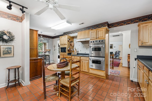 4 Dogwood Rd, Asheville, NC 28804 - kitchen featuring visible vents, light brown cabinets, dark countertops, brick floor, and appliances with stainless steel finishes