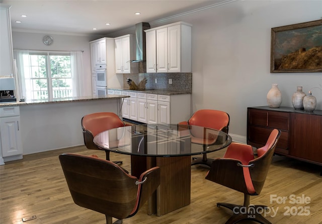 101 Skyview Dr, Asheville, NC 28804 - dining room with ornamental molding, light wood-style flooring, recessed lighting, and baseboards