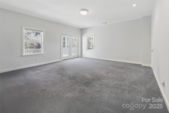 101 Skyview Dr, Asheville, NC 28804 - spare room featuring carpet, baseboards, and french doors