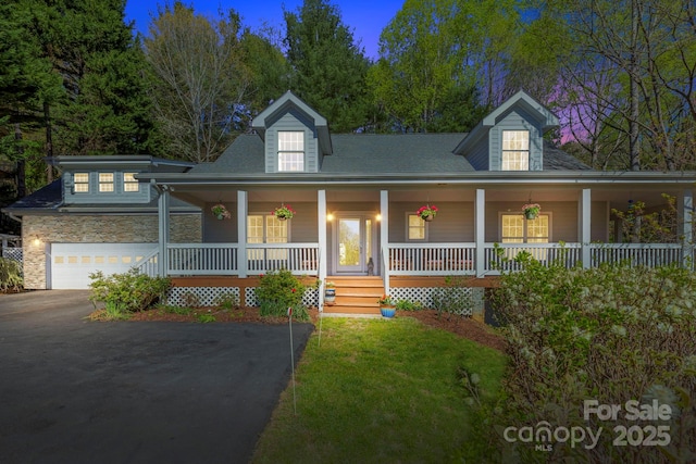 101 Skyview Dr, Asheville, NC 28804 - view of front of home with driveway, covered porch, stone siding, and a front lawn