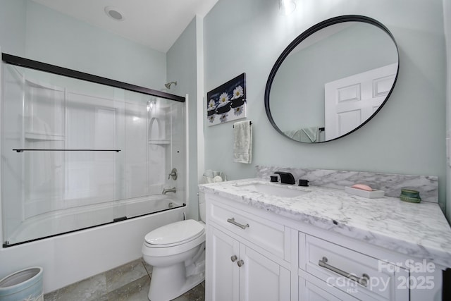 full bathroom with toilet, vanity, and bath / shower combo with glass door