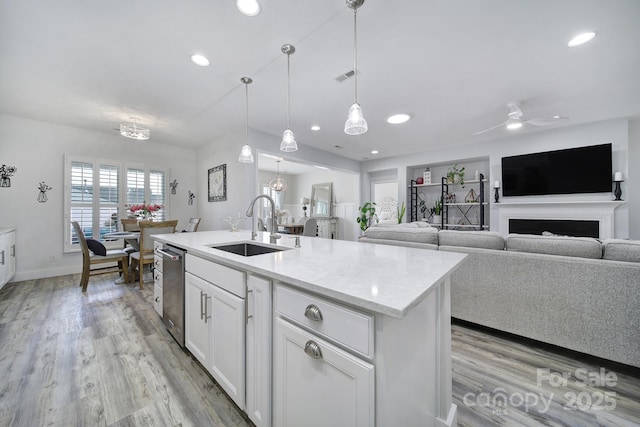 kitchen with light wood-style floors, a sink, visible vents, and recessed lighting