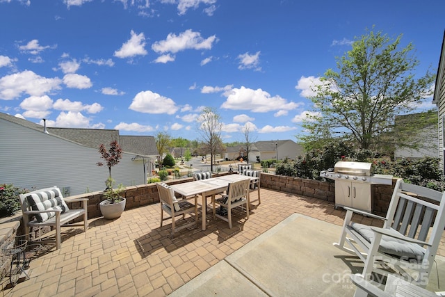 view of patio / terrace featuring outdoor dining area and grilling area