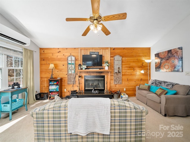 364 Blevins Knob Dr, Burnsville, NC 28714 - living room with vaulted ceiling, carpet, wooden walls, ceiling fan, and a glass covered fireplace