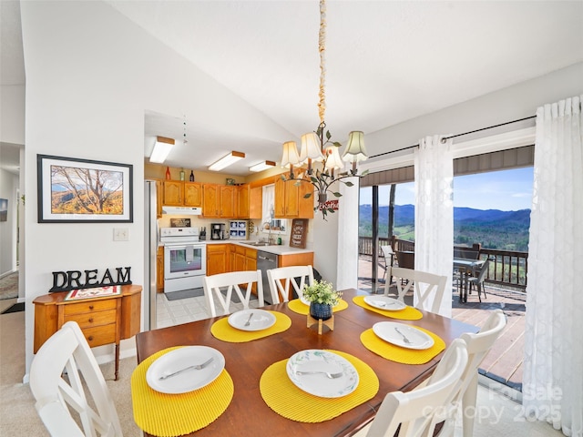 364 Blevins Knob Dr, Burnsville, NC 28714 - dining room with vaulted ceiling, a mountain view, and a chandelier