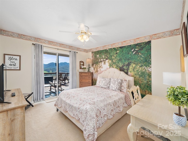 364 Blevins Knob Dr, Burnsville, NC 28714 - carpeted bedroom featuring a mountain view, access to outside, and ceiling fan