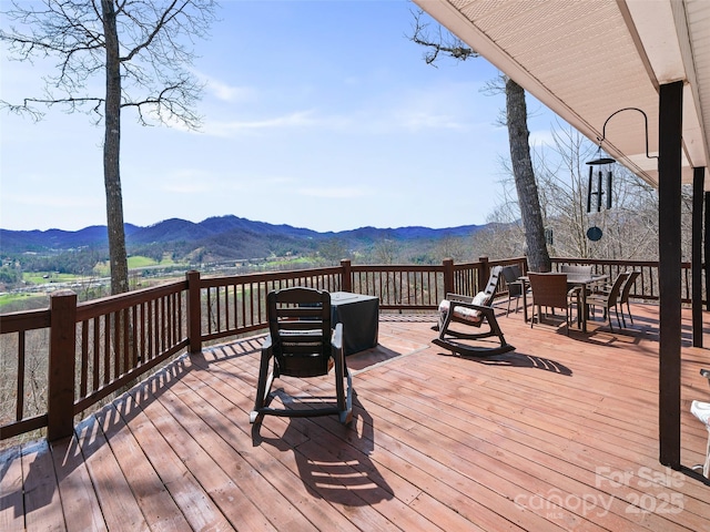 364 Blevins Knob Dr, Burnsville, NC 28714 - wooden terrace with outdoor dining space and a mountain view