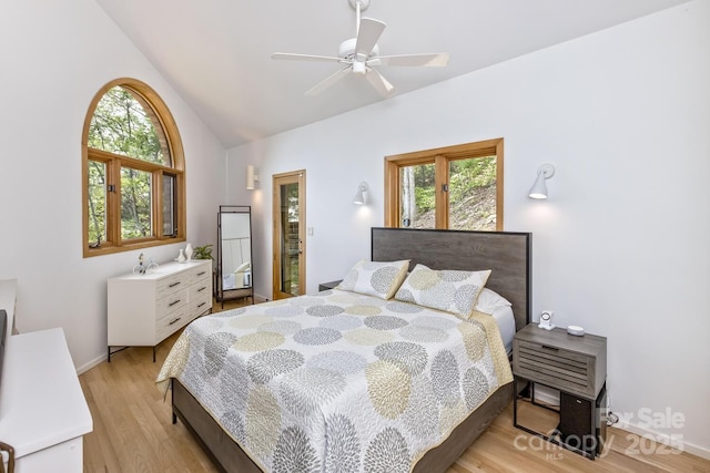 212 Chestnut Forest Rd, Fairview, NC 28730 - bedroom featuring light wood finished floors, high vaulted ceiling, baseboards, and a ceiling fan