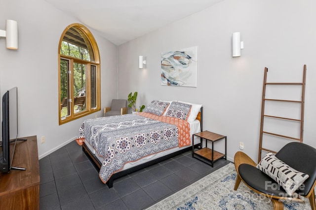 212 Chestnut Forest Rd, Fairview, NC 28730 - bedroom with dark tile patterned flooring and lofted ceiling