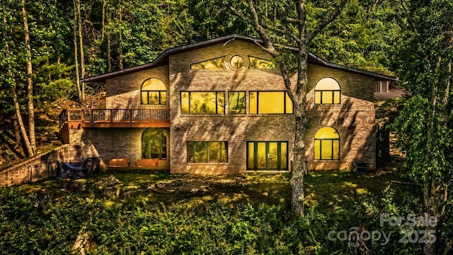 212 Chestnut Forest Rd, Fairview, NC 28730 - back of property featuring a lawn and a forest view