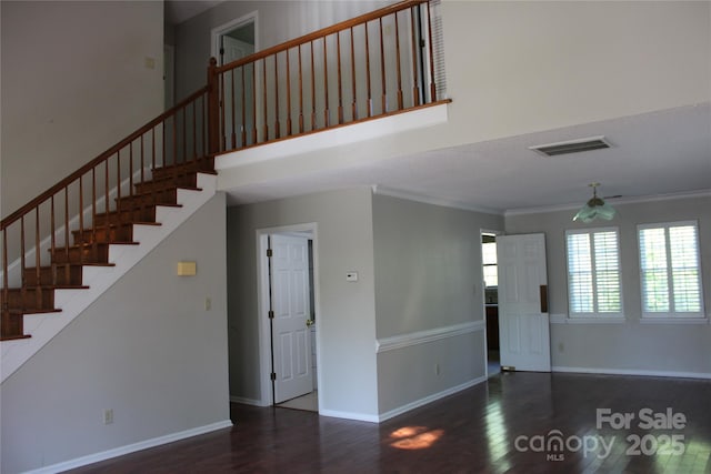 9915 Lottie Ln, Charlotte, NC 28262 - interior space featuring a high ceiling, wood finished floors, crown molding, and visible vents