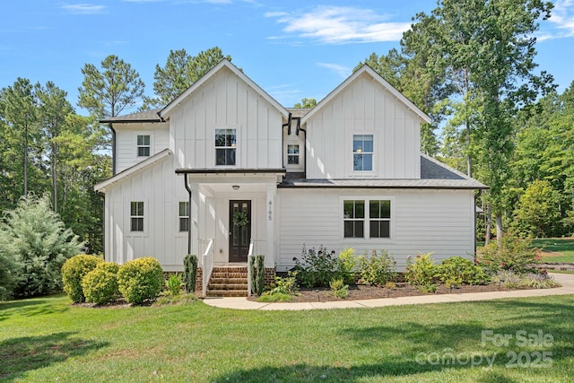 4195 Island Fox Ln, Denver, NC 28037 - modern farmhouse style home featuring board and batten siding, a shingled roof, and a front yard