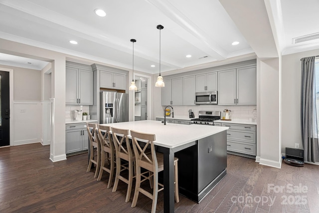4195 Island Fox Ln, Denver, NC 28037 - kitchen with stainless steel appliances, gray cabinetry, and backsplash