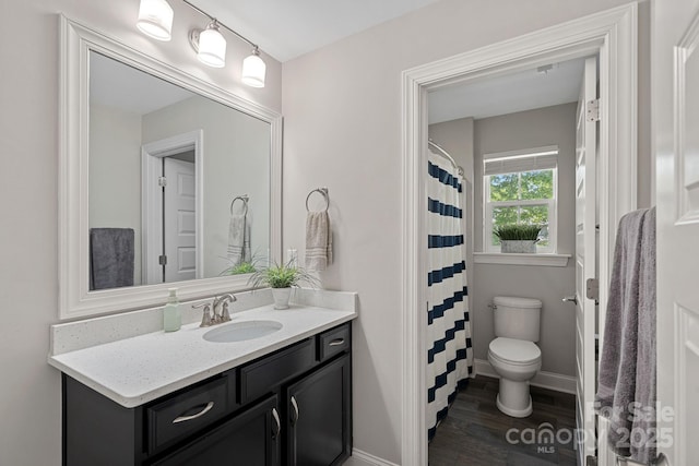 4195 Island Fox Ln, Denver, NC 28037 - bathroom featuring baseboards, wood finished floors, vanity, and toilet
