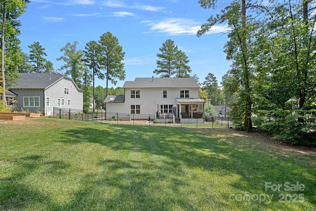 4195 Island Fox Ln, Denver, NC 28037 - back of property with a lawn, a vegetable garden, and a fenced backyard