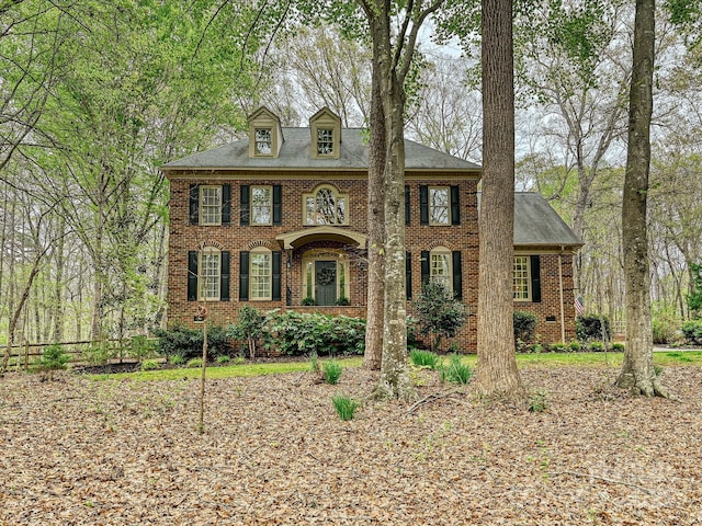 2313 Beechwood Dr, Waxhaw, NC 28173 - georgian-style home featuring brick siding, fence, and roof with shingles