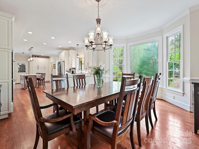 2313 Beechwood Dr, Waxhaw, NC 28173 - dining area with plenty of natural light, light wood-style floors, crown molding, a chandelier, and recessed lighting