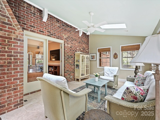 2313 Beechwood Dr, Waxhaw, NC 28173 - living room with a skylight, lofted ceiling, ceiling fan, light tile patterned floors, and brick wall