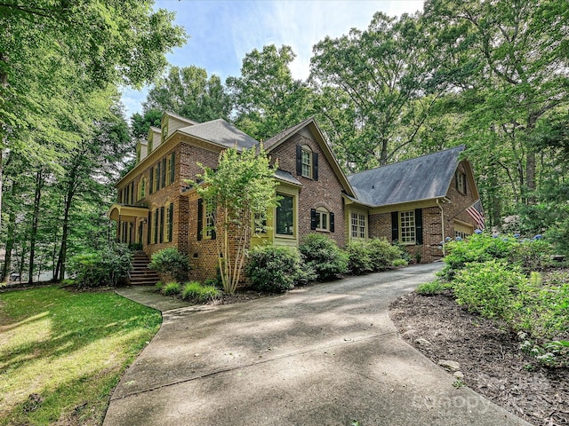 2313 Beechwood Dr, Waxhaw, NC 28173 - view of front of property with brick siding, concrete driveway, and a front lawn