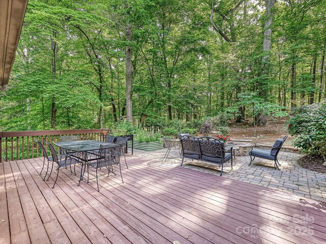 2313 Beechwood Dr, Waxhaw, NC 28173 - wooden deck with outdoor dining space, outdoor lounge area, and a view of trees