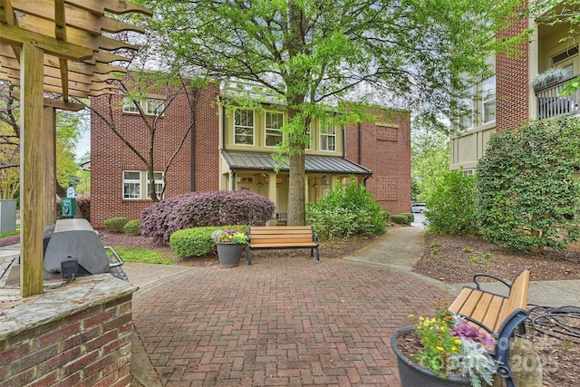 exterior space featuring area for grilling and a patio area
