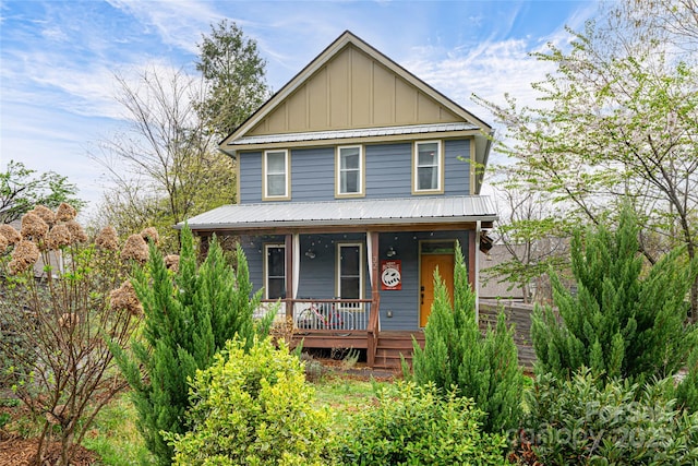 view of front facade with board and batten siding and a porch