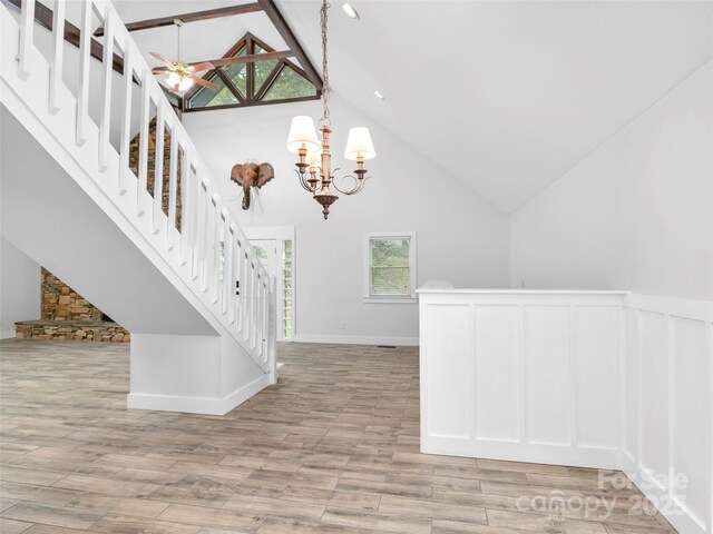 373 Vineyard Rd, Tryon, NC 28782 - staircase with a chandelier, high vaulted ceiling, and wood finished floors