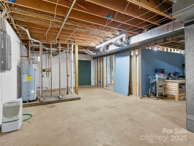 373 Vineyard Rd, Tryon, NC 28782 - unfinished basement featuring electric water heater and electric panel