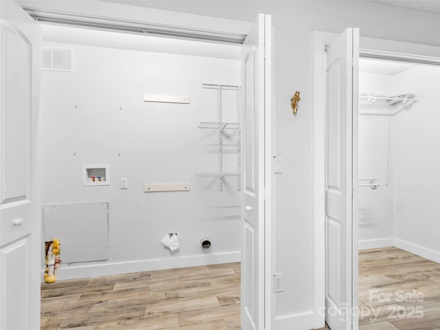 373 Vineyard Rd, Tryon, NC 28782 - laundry area featuring washer hookup, light wood-type flooring, and baseboards
