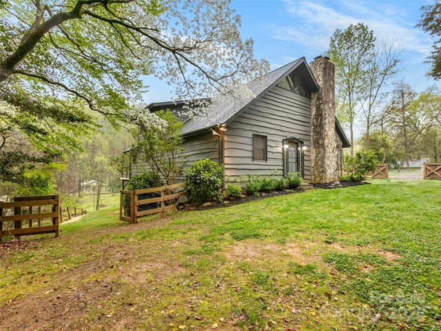 373 Vineyard Rd, Tryon, NC 28782 - view of side of property with a chimney and a shingled roof