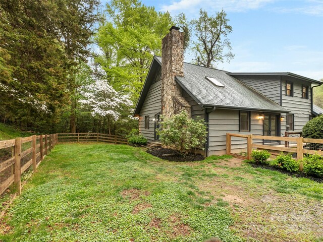 373 Vineyard Rd, Tryon, NC 28782 - view of side of property featuring a chimney, a wooden deck, and roof with shingles