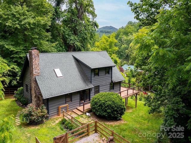 373 Vineyard Rd, Tryon, NC 28782 - view of front of home with a shingled roof, a chimney, and a deck