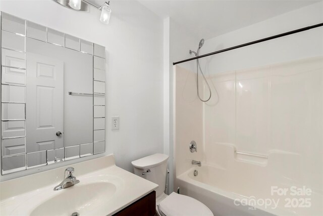 full bathroom with washtub / shower combination, toilet, and vanity