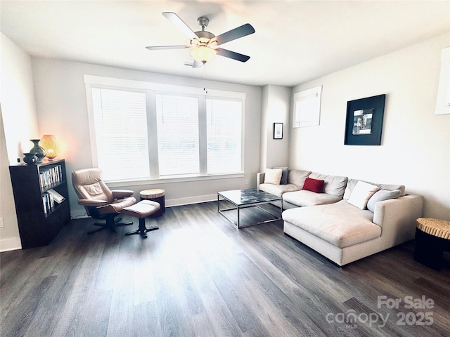 562 Amalfi Dr, Davidson, NC 28036 - living area with dark wood-style floors, baseboards, and a ceiling fan