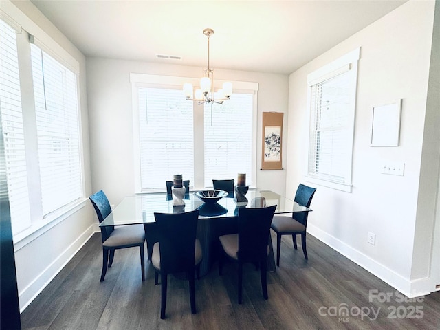 562 Amalfi Dr, Davidson, NC 28036 - dining space featuring a chandelier, dark wood-style floors, baseboards, and plenty of natural light