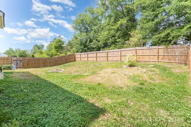 view of yard with a fenced backyard